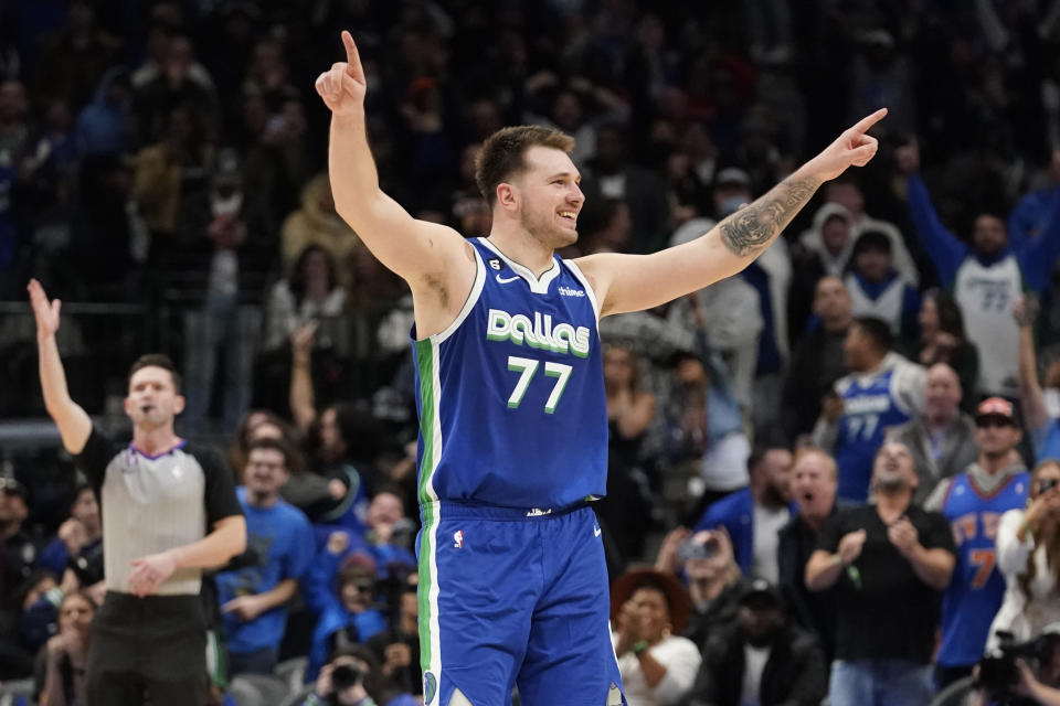 Dallas Mavericks guard Luka Doncic (77) celebrates scoring the game tying basket during the fourth quarter of the team's NBA basketball game against the New York Knicks in Dallas, Tuesday, Dec. 27, 2022. The Mavericks won in overtime, 126-121. (AP Photo/LM Otero)