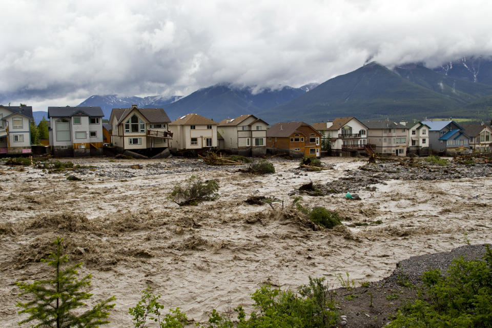 CANMORE, CANADA - JUNE 20:  Houses damaged along the edge of Cougar Creek are shown June 20, 2013 in Canmore, Alberta, Canada. Widespread flooding caused by torrential rains washed out bridges and roads prompting the evacuation of thousnds.  (Photo by John Gibson/Getty Images)