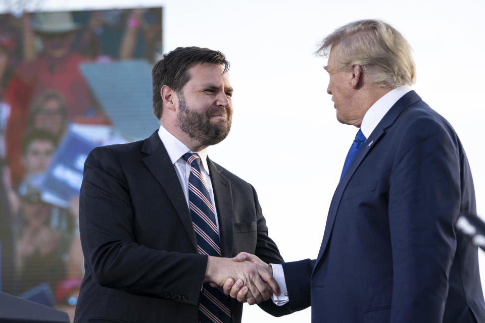  J.D. Vance, a Republican candidate for U.S. Senate in Ohio, shakes hands with former President Donald Trump during a rally hosted by the former president at the Delaware County Fairgrounds on April 23, 2022 in Delaware, Ohio. / Credit: Drew Angerer / Getty Images