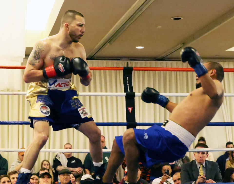Lightweight Kevin Walsh, of Brockton, reacts after landing a right hand to the jaw of Braulio Avila, of Big Bear Lake, California, for a second-round knockout win at the Castleton Banquet and Conference Center in Windham, New Hampshire, on Friday, April  22, 2022.