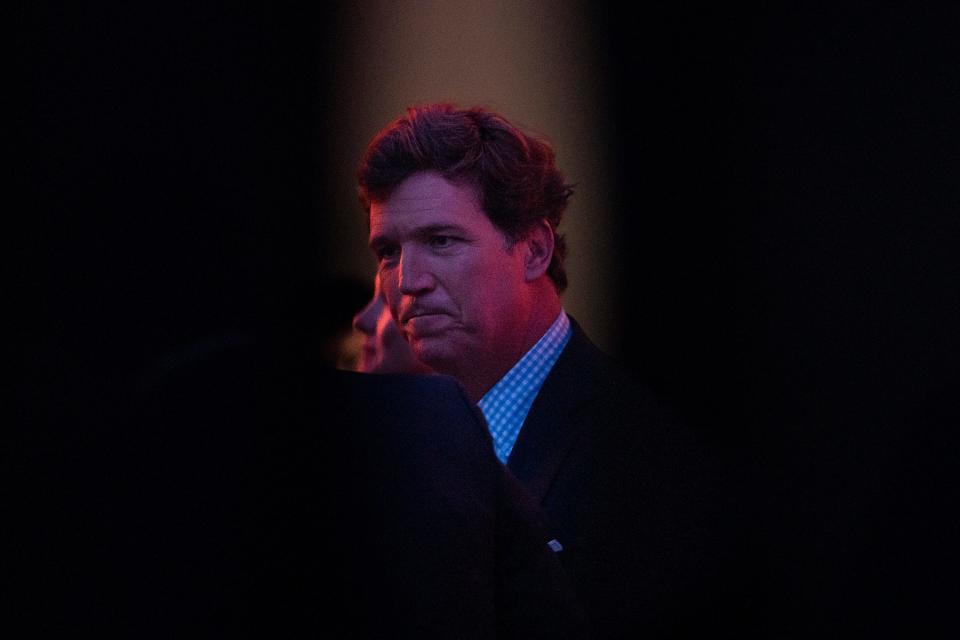 Tucker Carlson, a Fox News host, chats with people backstage before speaking during the FAMiLY Leadership Summit at the Community Choice Credit Union Convention Center Friday, July 15, 2022 in Des Moines.