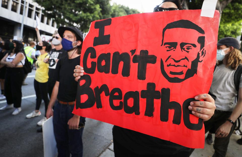 <p>A protestor holds up a sign bearing some of George Floyd’s last words: “I can’t breathe,” during a protest in Los Angeles in 2020.</p> (Getty Images)