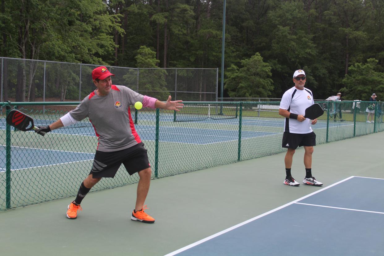 Dean Matt and Wayne Bigg play in pickleball game against Jimmy Santangelo and Wilmington City Council member Clifford Barnett at Northern Regional Park in Castle Hayne on Thursday. Matt is attempting to play a game of pickleball in each of the 48 contiguous U.S. states within a span of 26 days.