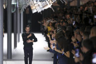 Nicolas Ghesquiere accepts applause after the Louis Vuitton Fall/Winter 2024-2025 ready-to-wear collection presented Tuesday, March 5, 2024 in Paris. (Photo by Vianney Le Caer/Invision/AP)