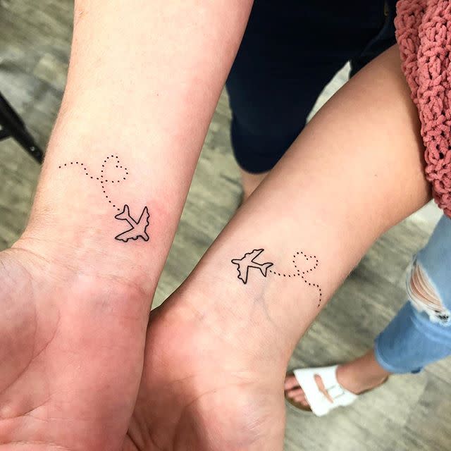 4) This Mother-Daughter Travel Tattoo