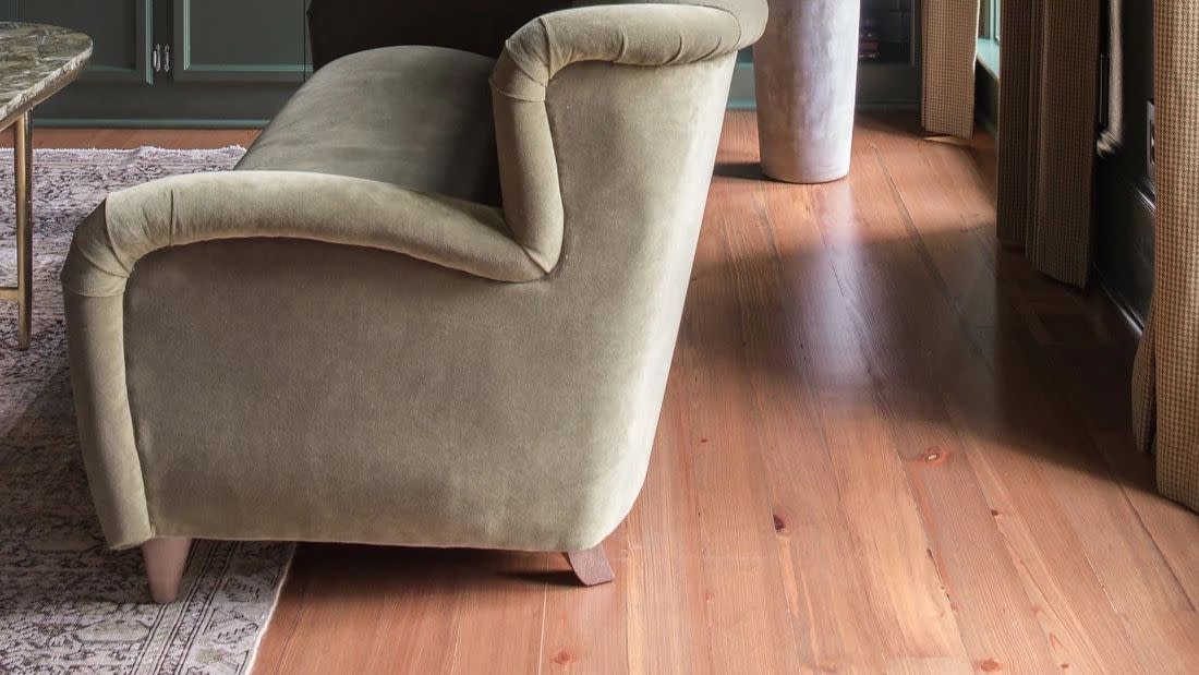 a chair in front of a bookcase