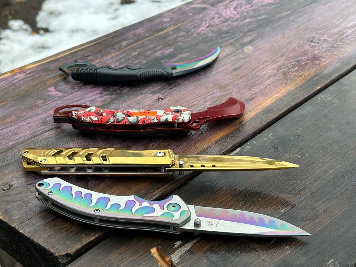 Community residents say the pocked-sized knives sold at convenience stores are made to inflict harm and should be regulated.  (Emily Fitzpatrick/CBC - image credit)