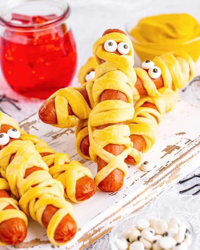 <p>The Country Cook</p><p>Kids love to help make these come Halloween. Perfect for a quick snack or spooky party buffet.</p><p><strong>Get the recipe: <a href="https://www.thecountrycook.net/halloween-mummy-dogs/" rel="nofollow noopener" target="_blank" data-ylk="slk:Mummy Hot Dogs;elm:context_link;itc:0;sec:content-canvas" class="link ">Mummy Hot Dogs</a></strong></p><p><strong>Related: <a href="https://www.yahoo.com/lifestyle/40-easy-hot-dog-recipes-152823843.html" data-ylk="slk:40 Best Hot Dog Recipes;elm:context_link;itc:0;sec:content-canvas;outcm:mb_qualified_link;_E:mb_qualified_link;ct:story;" class="link  yahoo-link">40 Best Hot Dog Recipes</a></strong></p>