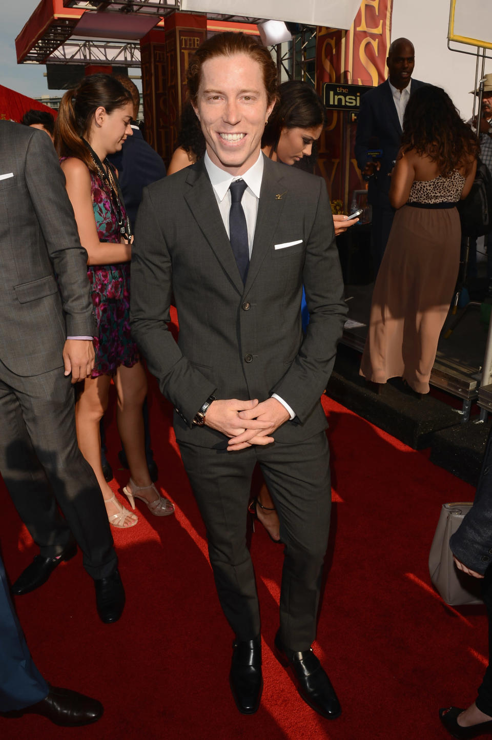 Action sports icon Shaun White looks just as comfortable in a suit than his day-to-day competition duds: jeans and a T-shirt or snow pants and a jacket. Though the Flying Tomato is a little less-recognizable with that crop of red hair pulled back, no? (Photo by Jason Merritt/Getty Images)