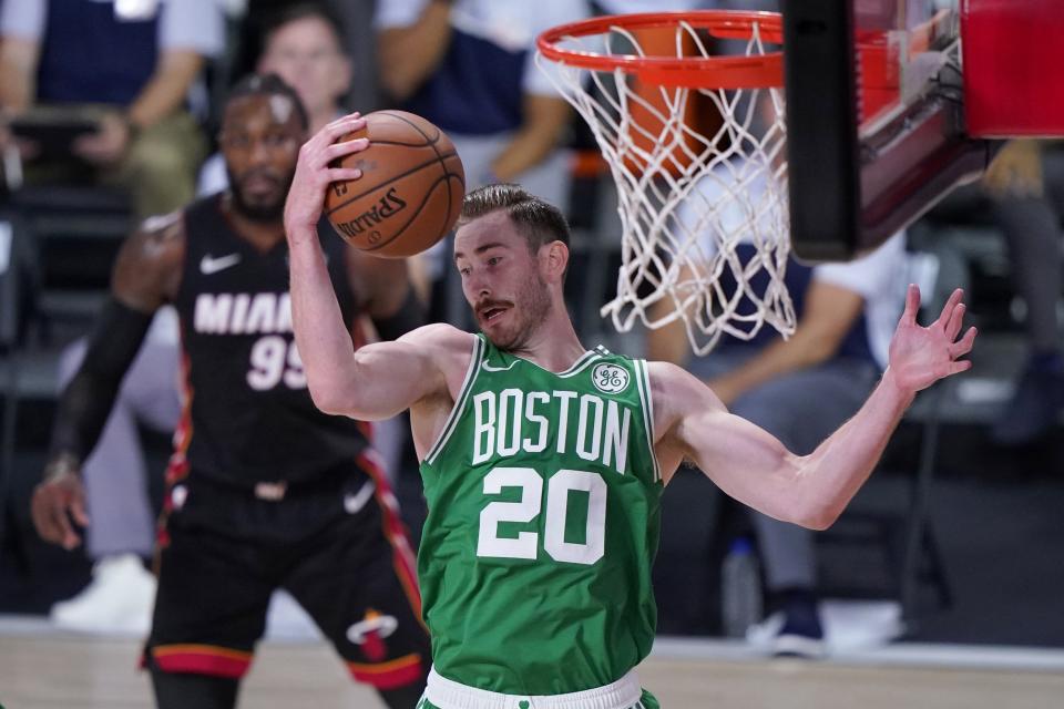 Boston Celtics forward Gordon Hayward (20) comes down with a rebound during the first half of an NBA conference final playoff basketball game against the Miami Heat on Saturday, Sept. 19, 2020, in Lake Buena Vista, Fla. (AP Photo/Mark J. Terrill)