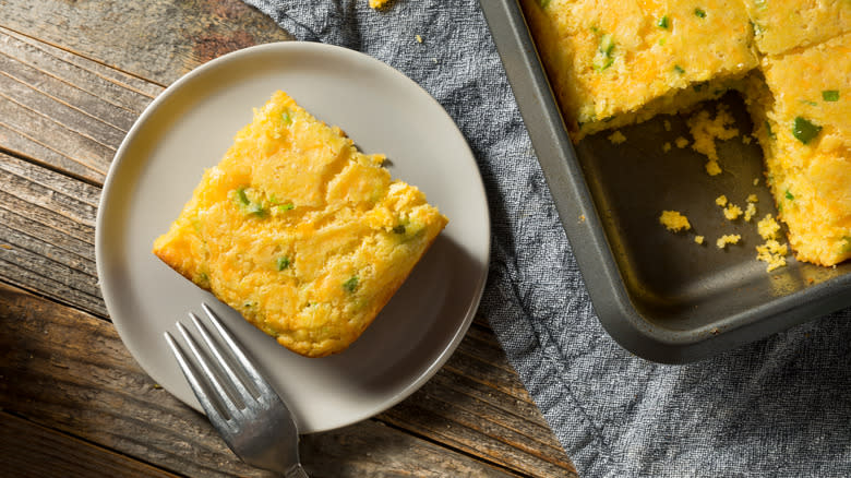Slice of herb and cheddar cornbread on plate 