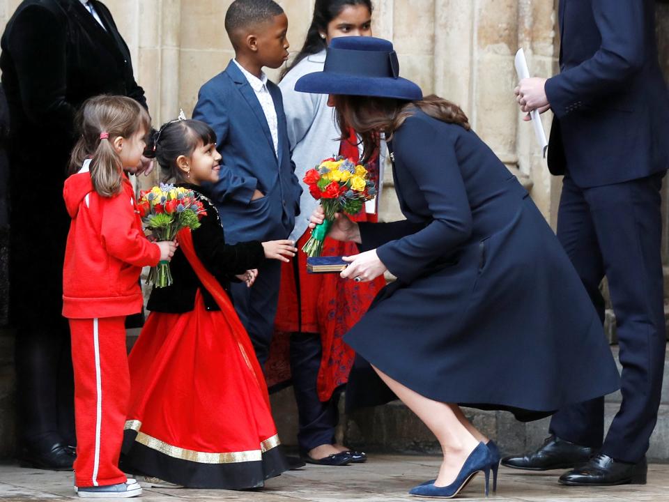 Kate Middleton greets two young girls in 2018.