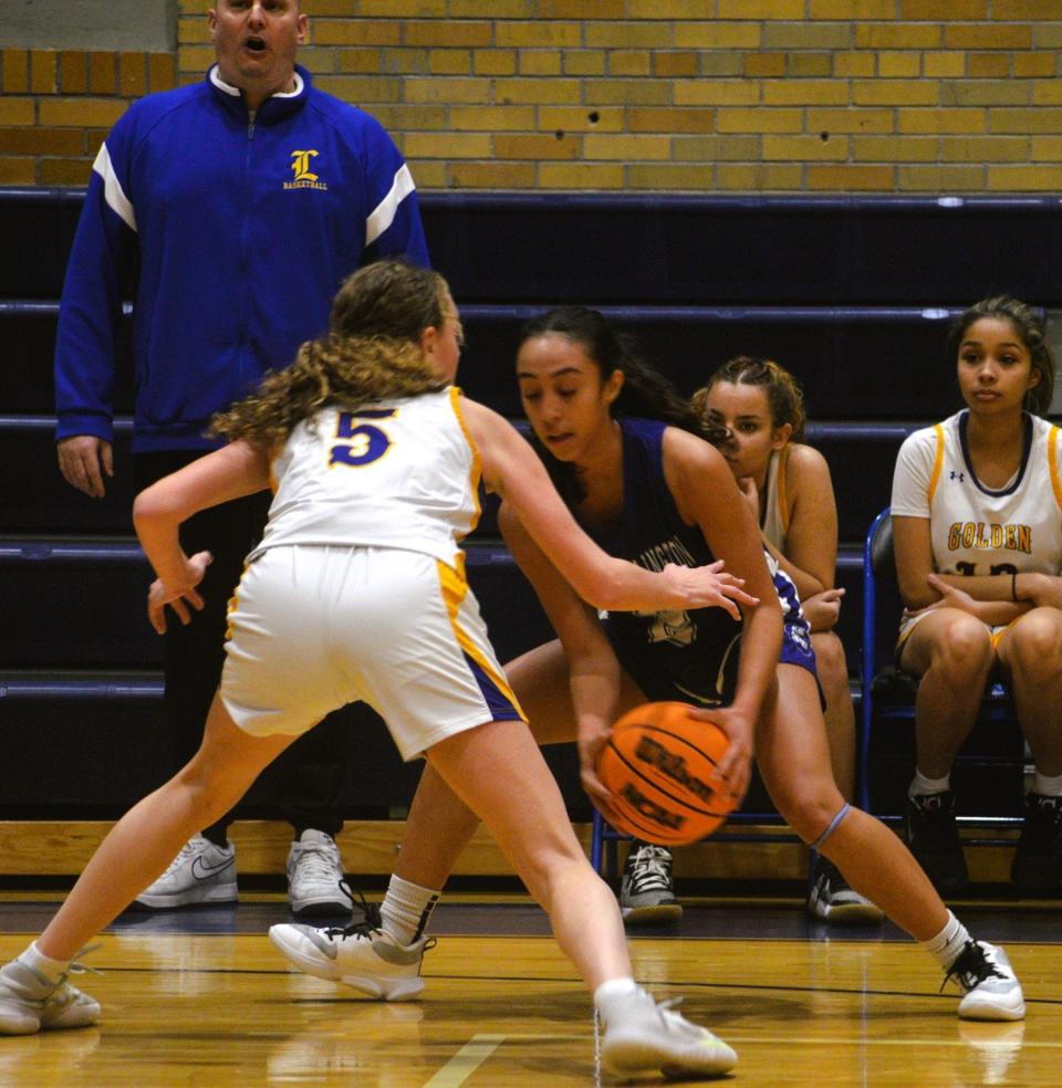 North Arlington's Kyra Garcia (with ball) tries to get by Lyndhurst's Kyla Marino (left) in a Jan. 3 battle of the two rivals. Lyndhhurst raised its record to 5-2. The Vikings dropped to 6-2 on the season.