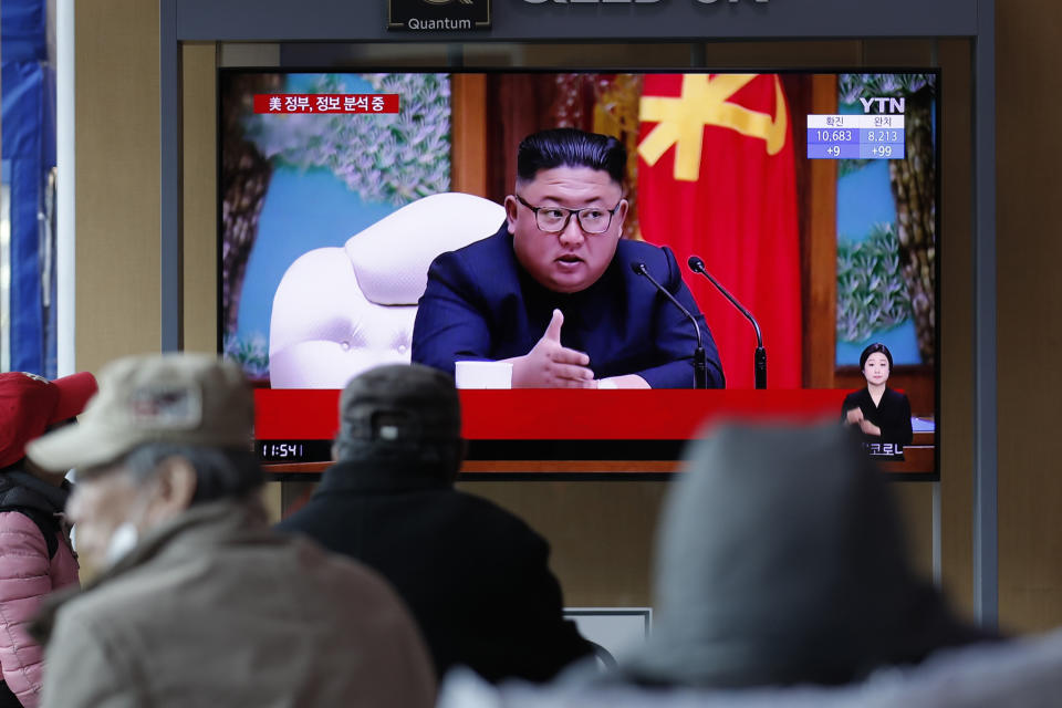 People watch a TV screen showing a news program reporting about North Korean leader Kim Jong Un with a file image at the Seoul Railway Station in Seoul, South Korea, Tuesday, April 21, 2020. The South Korean government is looking into unconfirmed reports saying North Korean leader Kim is in fragile condition after surgery. (AP Photo/Lee Jin-man)