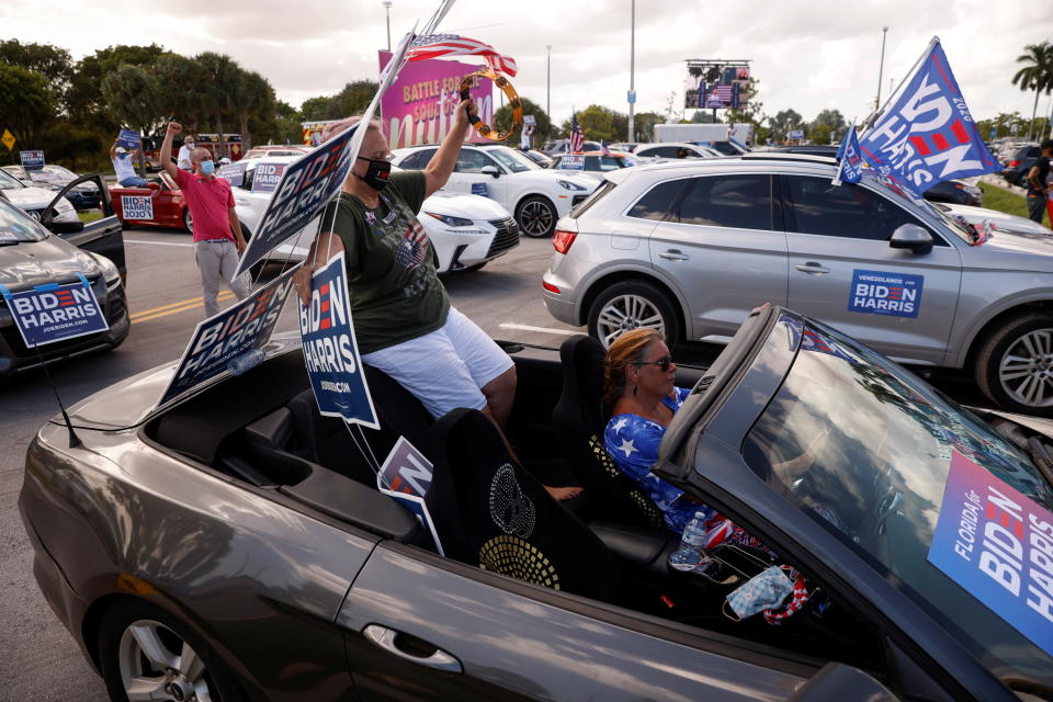 Supporters of the democratic U.S. presidential nominee and former Vice President Joe Biden are seen at a drive-in, at Get Out the Vote campaign stop in Coconut Creek, Florida, U.S., October 29, 2020. (Brian Snyder/Reuters)