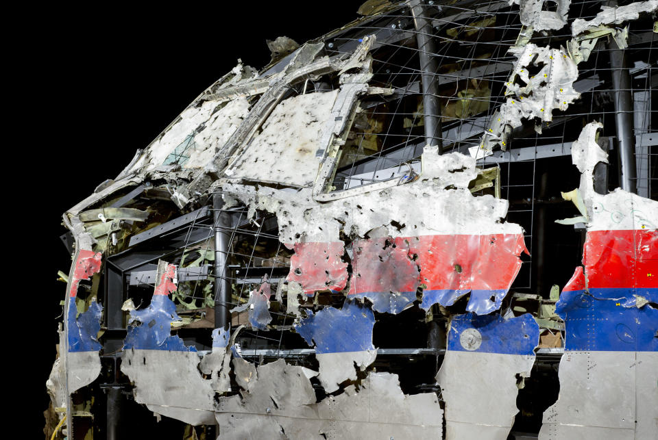 FILE - In this Tuesday, Oct. 13, 2015, file image, the reconstructed cockpit of Malaysia Airlines Flight MH17 plane is displayed before a news conference by the Dutch Safety Board in Gilze-Rijen, Netherlands. United by grief across oceans and continents, families who lost loved ones when Malaysia Airlines Flight 17 was shot down in 2014 hope that a trial starting next week will finally deliver them something that has remained elusive ever since: The truth. (AP Photo/Peter Dejong, File)