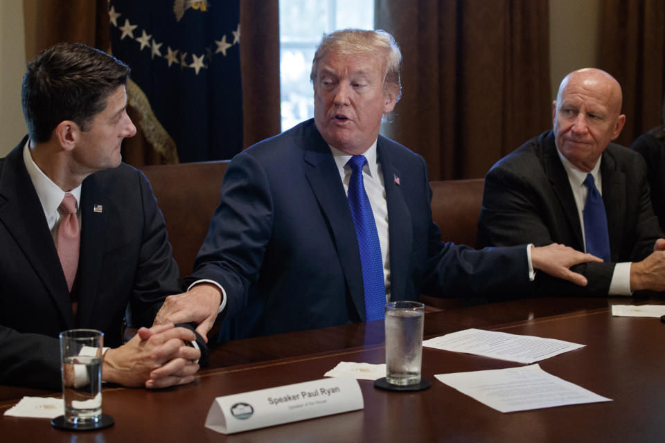 President Donald Trump speaks during a meeting on tax policy with Republican lawmakers in the Cabinet Room of the White House in Washington, with House Speaker Paul Ryan of Wis., and Chairman of the House Ways and Means Committee Rep. Kevin Brady, R-Texas, right. (AP Photo/Evan Vucci)