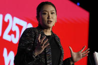 The daughter of Thailand's former Prime Minister Thaksin Shinawatra, Paetongtarn Shinawatra cheers with supporters during a Pheu Thai party general assembly meeting in Bangkok, Thailand, Tuesday, Dec. 6, 2022. Shinawatra promised a new era of social equality Tuesday, saying if her party is elected to power in next year's election it will bring an end to poverty in the Southeast Asian nation. (AP Photo/Sakchai Lalit)