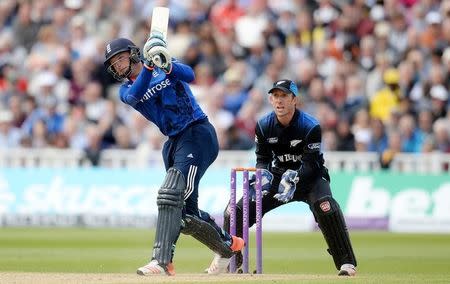 Cricket - England v New Zealand - First Royal London One Day International - Edgbaston - 9/6/15 England's Jos Buttler hits a six as New Zealand's Luke Ronchi watches Action Images via Reuters / Philip Brown Livepic