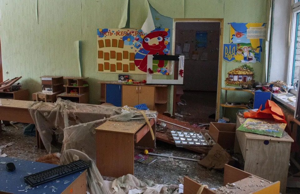 Debris scatters a kindergarten that was damaged by shelling, in Kharkiv, Ukraine, Sunday, March 13, 2022. (AP Photo/Andrew Marienko)