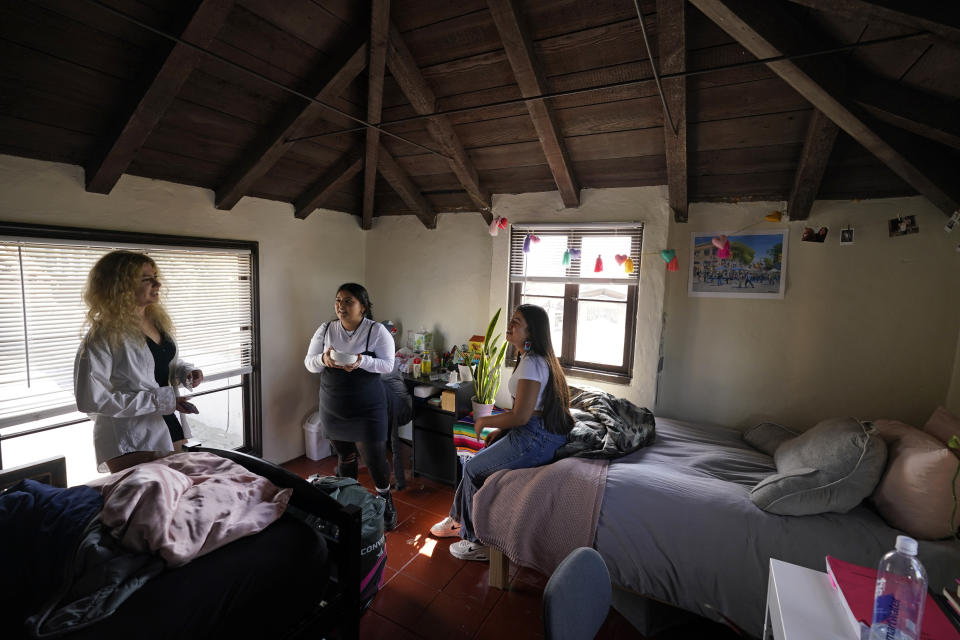 From left, University of California, Berkeley students Sofia Howard-Jimenez, Jennifer Lopez, and Aisha Wallace-Palomares talk in a loft bedroom of the apartment they share with one other in Berkeley, Calif., Tuesday, March 29, 2022. Millions of college students in the U.S. are trying to find an affordable place to live as rents surge nationally, affecting seniors, young families and students alike. (AP Photo/Eric Risberg)