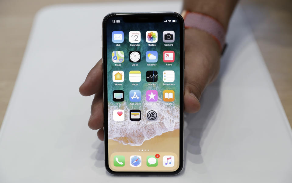 The new iPhone X is displayed in the showroom after the new product announcement at the Steve Jobs Theater on the new Apple campus on Tuesday, Sept. 12, 2017, in Cupertino, Calif. (AP Photo/Marcio Jose Sanchez)