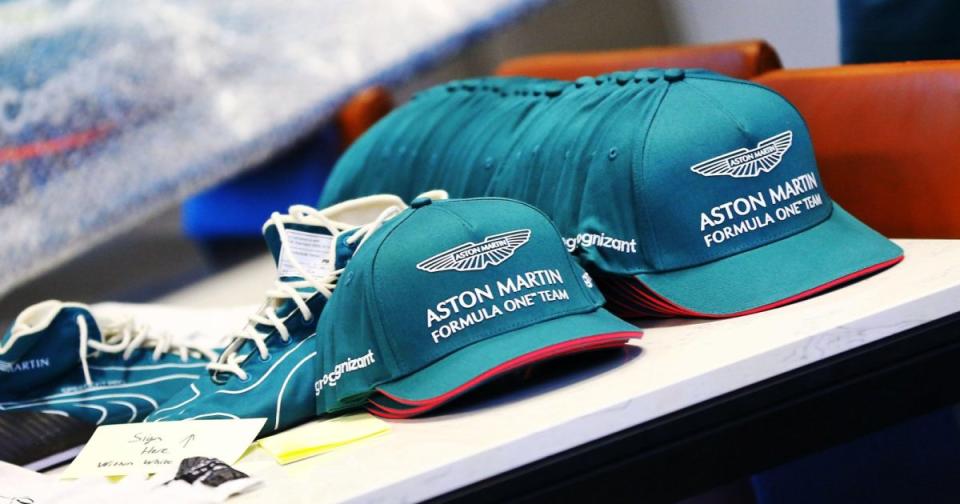 Aston Martin Formula 1 hats on a table. Sao Paulo, November 2021. Credit: Alamy