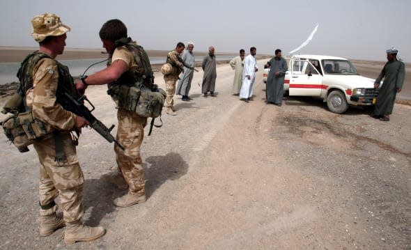 British soldiers search vehicle