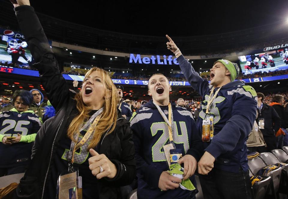 Seattle Seahawks fans cheer before the NFL Super Bowl XLVIII football game between the Seattle Seahawks and the Denver Broncos Sunday, Feb. 2, 2014, in East Rutherford, N.J. (AP Photo/Kathy Willens)