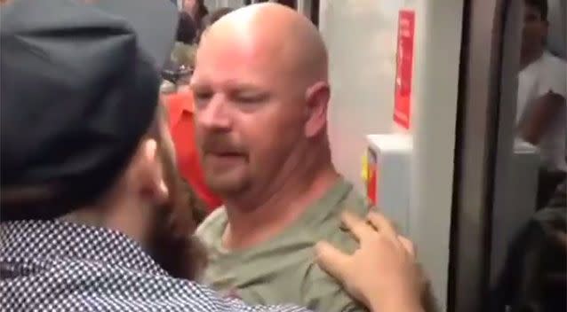 A man tries to calm the bald man down after the brawl. Source: Instagram/ Luke Bennie