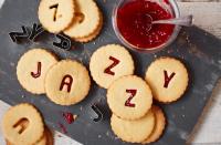 <p>Homebaked jammie dodgers are sure to prove a hit with the kids (and parents). These alphabet-shaped biscuits take 15 minutes to prep – perfect for keeping the kids occupied after school. For the full recipe, visit <a rel="nofollow noopener" href="https://realfood.tesco.com/recipes/jazzy-jammie-dodgers.html" target="_blank" data-ylk="slk:Tesco;elm:context_link;itc:0;sec:content-canvas" class="link ">Tesco</a>. </p>