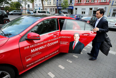 Mahmut Oezdemir of the Social Democratic party SPD gets into his election campaign car in Marxloh a suburb of Germany's rust-belt city Duisburg, Germany, September 13, 2017. REUTERS/Wolfgang Rattay