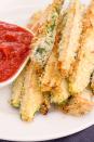 <p>A light coating of panko bread crumbs and 20 minutes in the oven transforms thick slices of zucchini into everyone's favorite finger food.</p><p>Get the recipe from <a href="https://www.delish.com/cooking/recipe-ideas/recipes/a43640/zucchini-fries-recipe/" rel="nofollow noopener" target="_blank" data-ylk="slk:Delish;elm:context_link;itc:0;sec:content-canvas" class="link ">Delish</a>.</p>