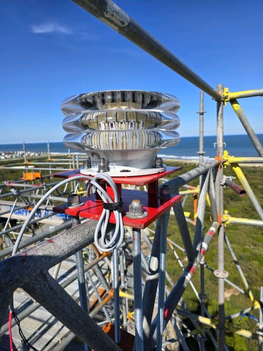 U.S. Coast Guard approved temporary beacon attached to Cape Hatteras Lighthouse scaffolding.