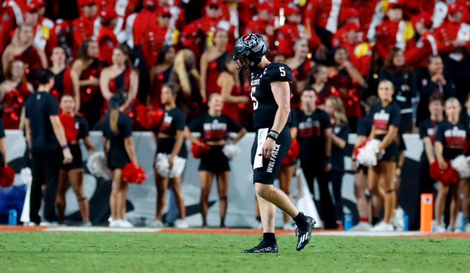N.C. State quarterback Brennan Armstrong (5) walks off the field after throwing an interception in the final minute of Louisville’s 13-10 victory over N.C. State at Carter-Finley Stadium in Raleigh, N.C., Friday, Sept. 29, 2023.