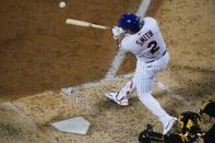 New York Mets' Dominic Smith (2) hits an RBI-single during the sixth inning of a baseball game against the Pittsburgh Pirates Friday, July 9, 2021, in New York. (AP Photo/Frank Franklin II)