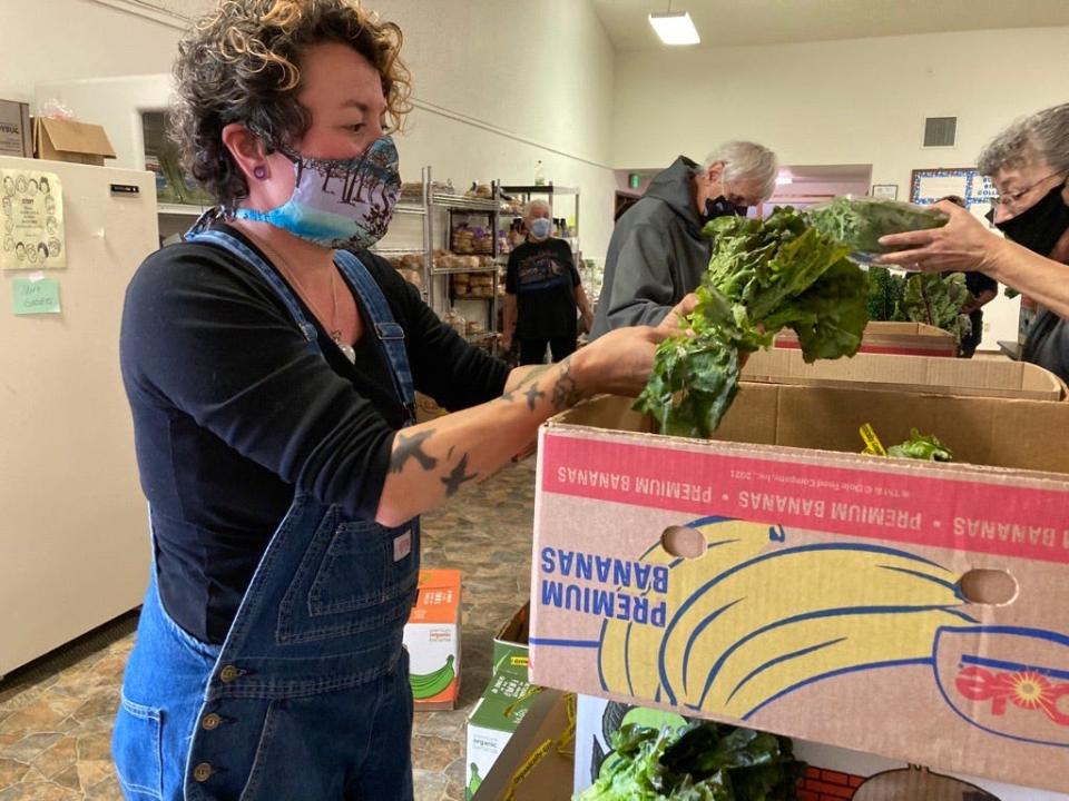 Burrito Brigade members assemble its free grocery store, the Waste to Taste Food Rescue program.