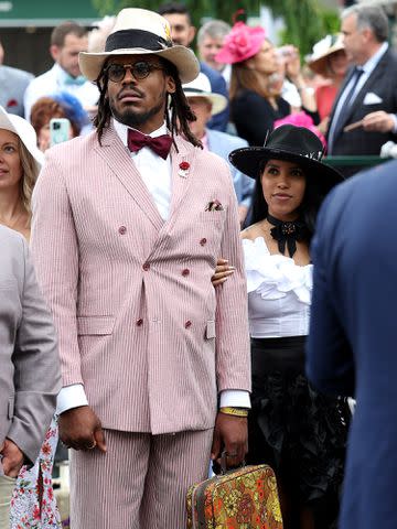<p>Gunnar Word/Getty</p> Cam Newton and Jasmin Brown at the 148th Kentucky Derby at Churchill Downs on May 07, 2022.