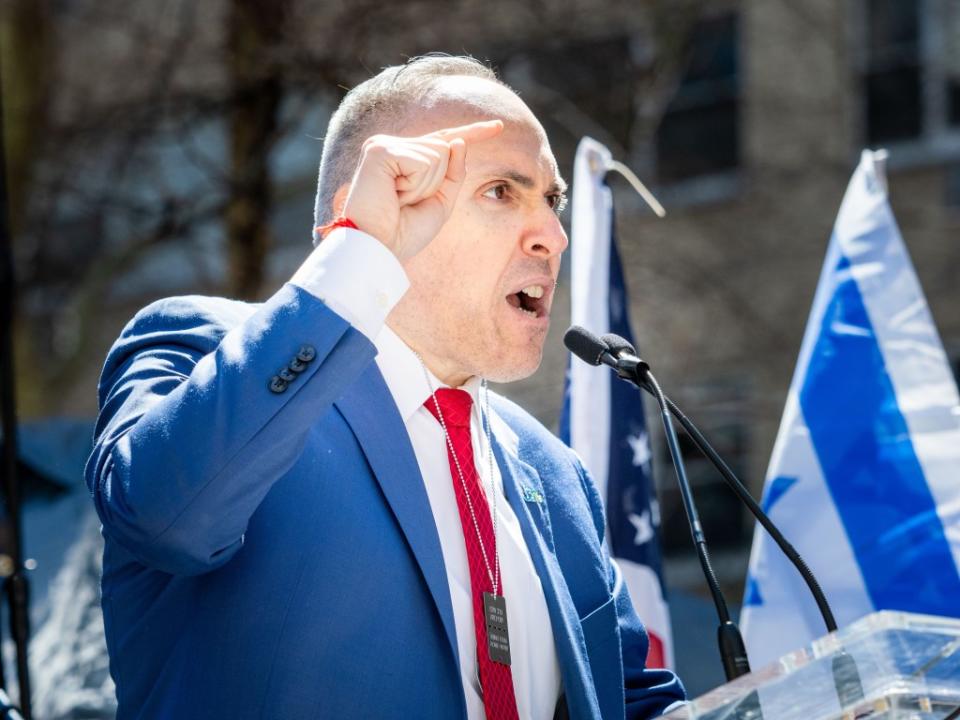 Mark Treyger, CEO of Jewish Community Relations Council speaks about the spirit of the Israeli and Jewish people during a demonstration calling for the release of hostages from Hamas captivity. Carlos Chiossone/SOPA Images/Shutterstock