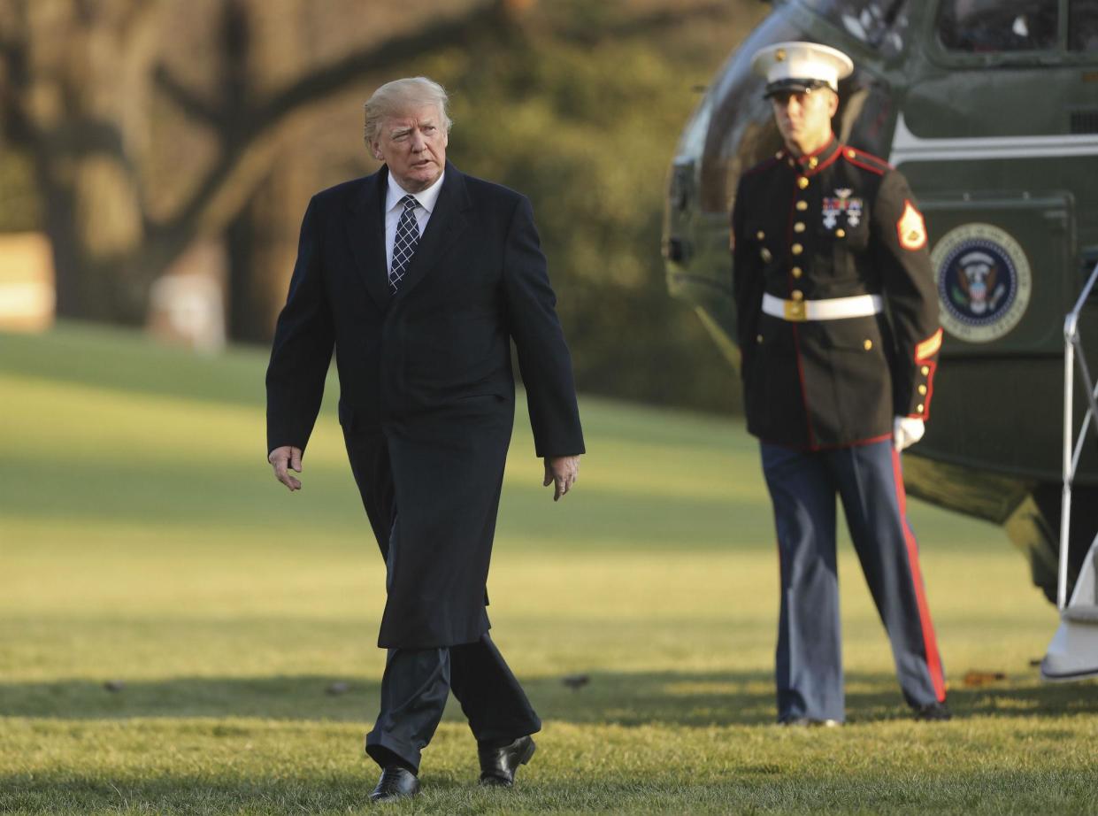 Donald Trump walks across the South Lawn of the White House in Washington: AP