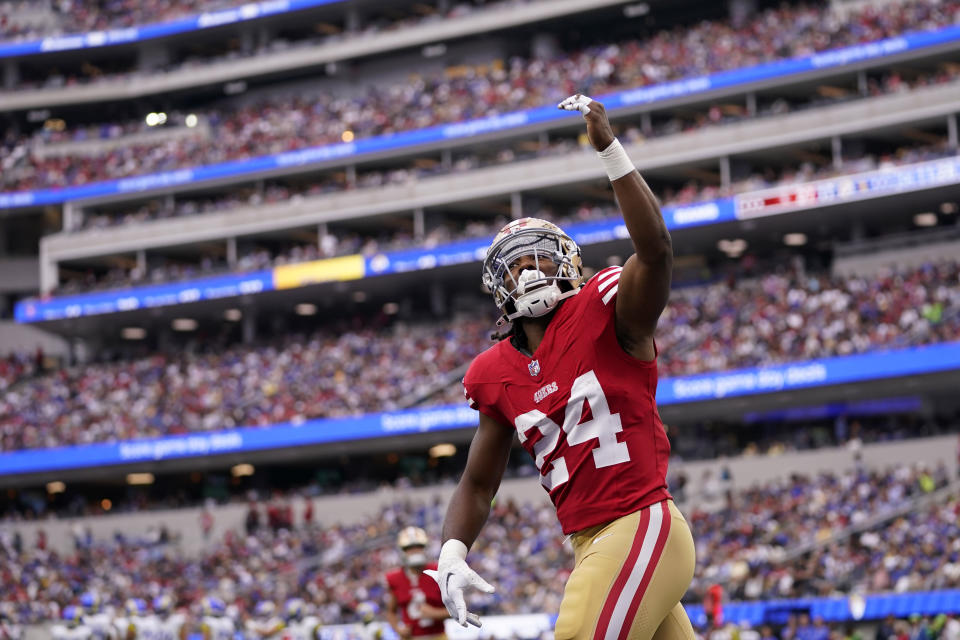 San Francisco 49ers running back Jordan Mason celebrates after wide receiver Deebo Samuel scored a touchdown during the second half of an NFL football game against the Los Angeles Rams Sunday, Sept. 17, 2023, in Inglewood, Calif. (AP Photo/Ashley Landis)