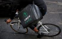 An UberEATS food delivery courier rides his bike in London, Britain September 7, 2016. REUTERS/Neil Hall