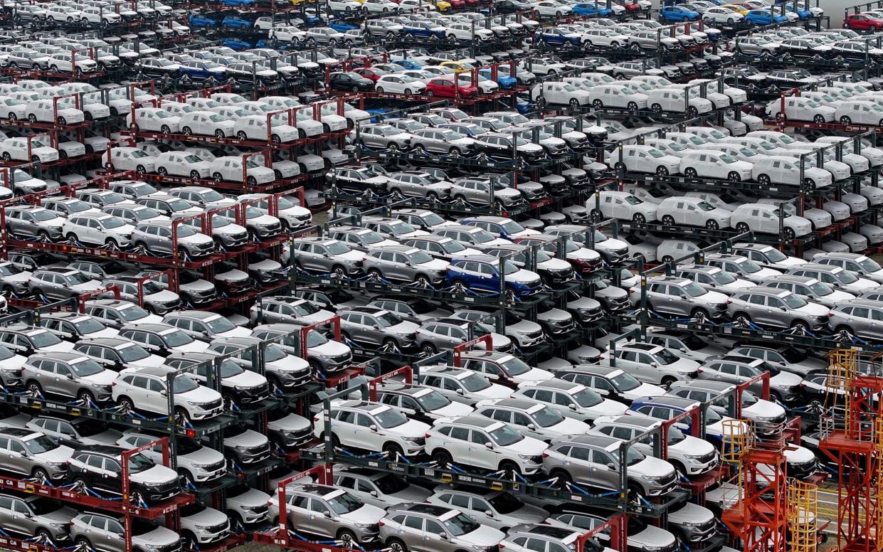 Electric cars for export stacked at the international container terminal of Taicang Port