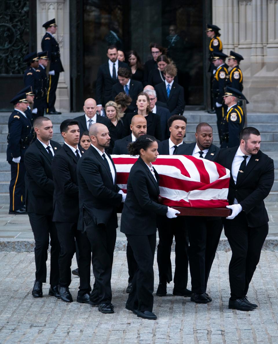 The casket of former US Supreme Court Justice Sandra Day O'Connor departs the funeral service at the National Cathedral.