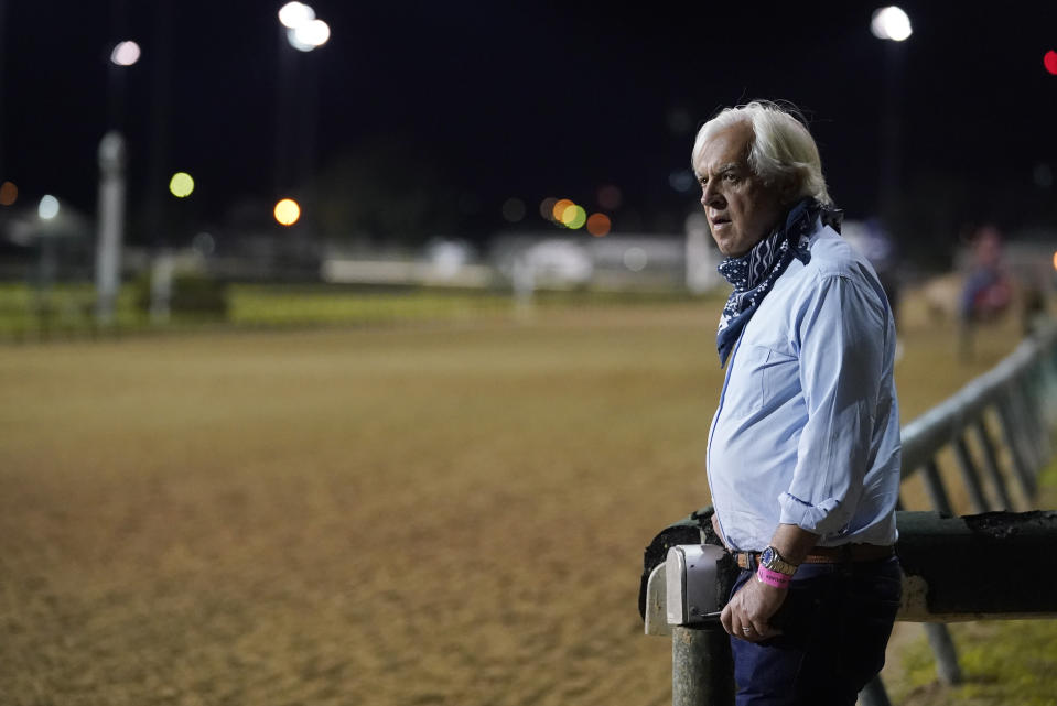 FILE - In this Sept. 4, 2020 file photo, trainer Bob Baffert watches at horses workout at Churchill Downs in Louisville, Ky. A filly trained by the two-time Triple Crown winner has tested positive in a post-race drug test for the second time this year, making it the third positive test by a horse in Baffert’s stable in the last six months. Craig Robertson, Baffert’s attorney, issued a statement confirming Gamine’s test results after her third-place finish as the 7-10 favorite in the Kentucky Oaks at Churchill Downs on Sept. 4. (AP Photo/Darron Cummings, File)