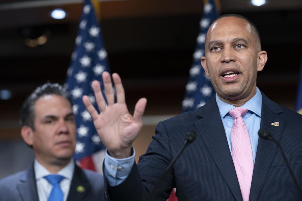 House Minority Leader Hakeem Jeffries talks to reporters at the Capitol in Washington.