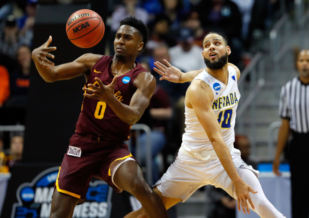 Loyola-Nevada came down to the final minutes, as Donte Ingram (0) and Caleb Martin (10) did battle. (Getty)