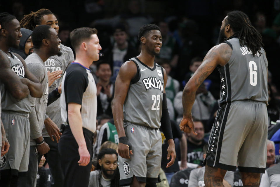 Brooklyn Nets guard Caris LeVert (22) celebrates with center DeAndre Jordan (6) late in overtime of the team's NBA basketball game against the Boston Celtics, Tuesday, March 3, 2020, in Boston. (AP Photo/Mary Schwalm)