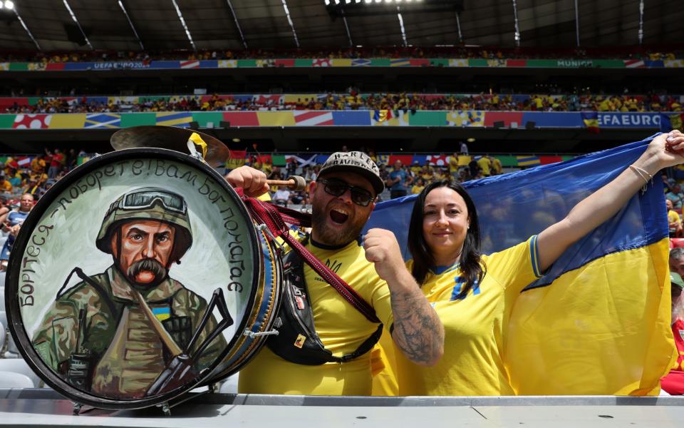 Ukrainian supporters in the stadium before the start of the group game between Romania and Ukraine