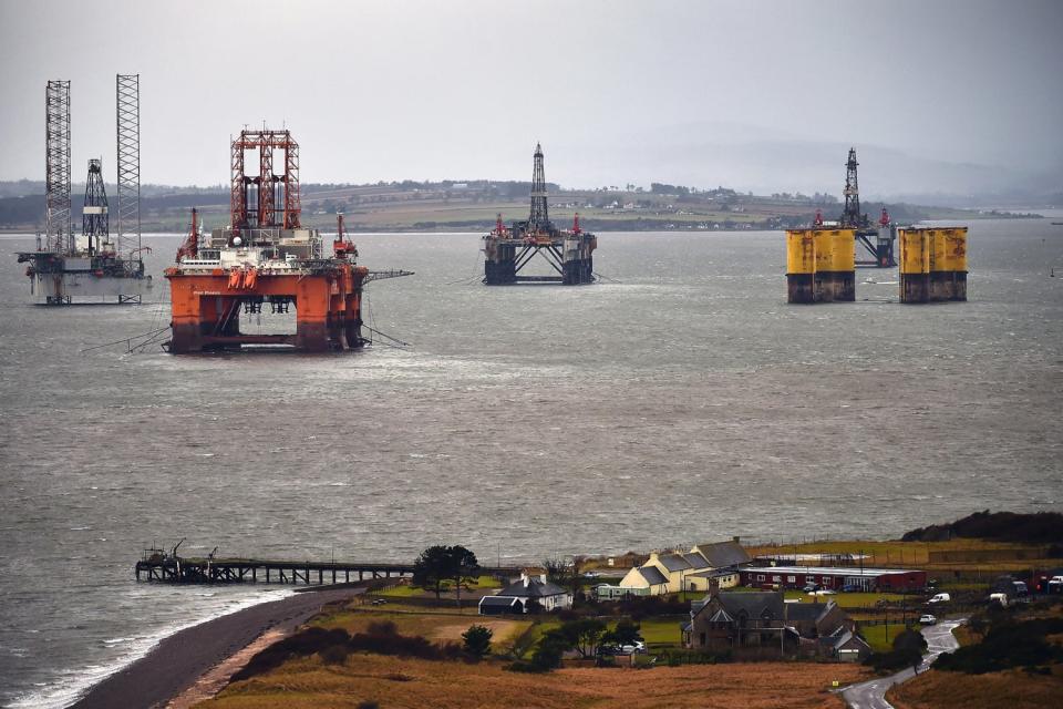 Oil rig platforms being stacked up in the Cromarty Firth, Scotland, as oil prices continue to decline